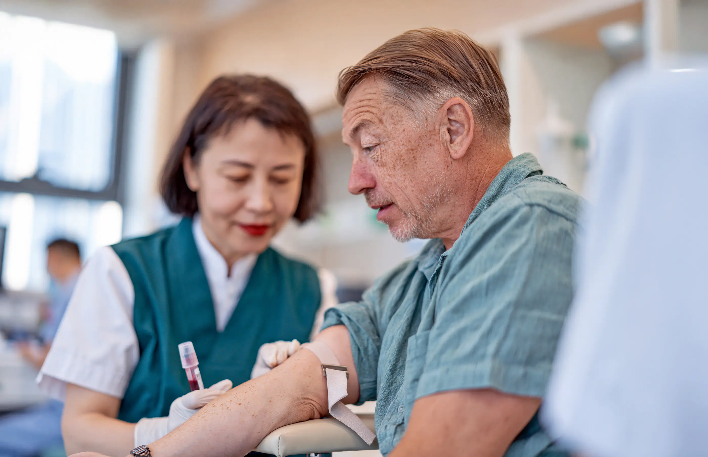 A blood sample being taken as part of a comprehensive screening.