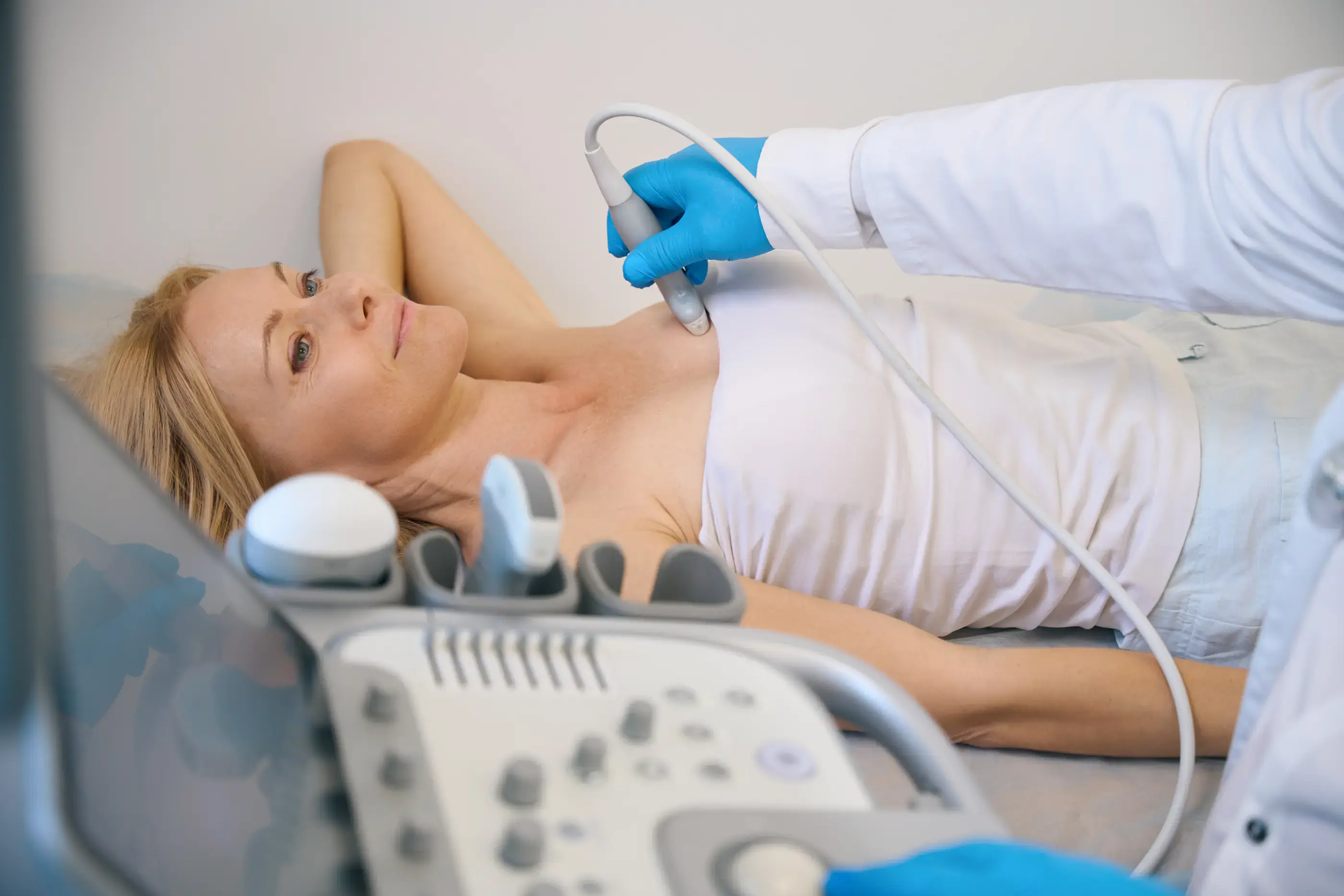 A clinical breast examination at a modern clinic.