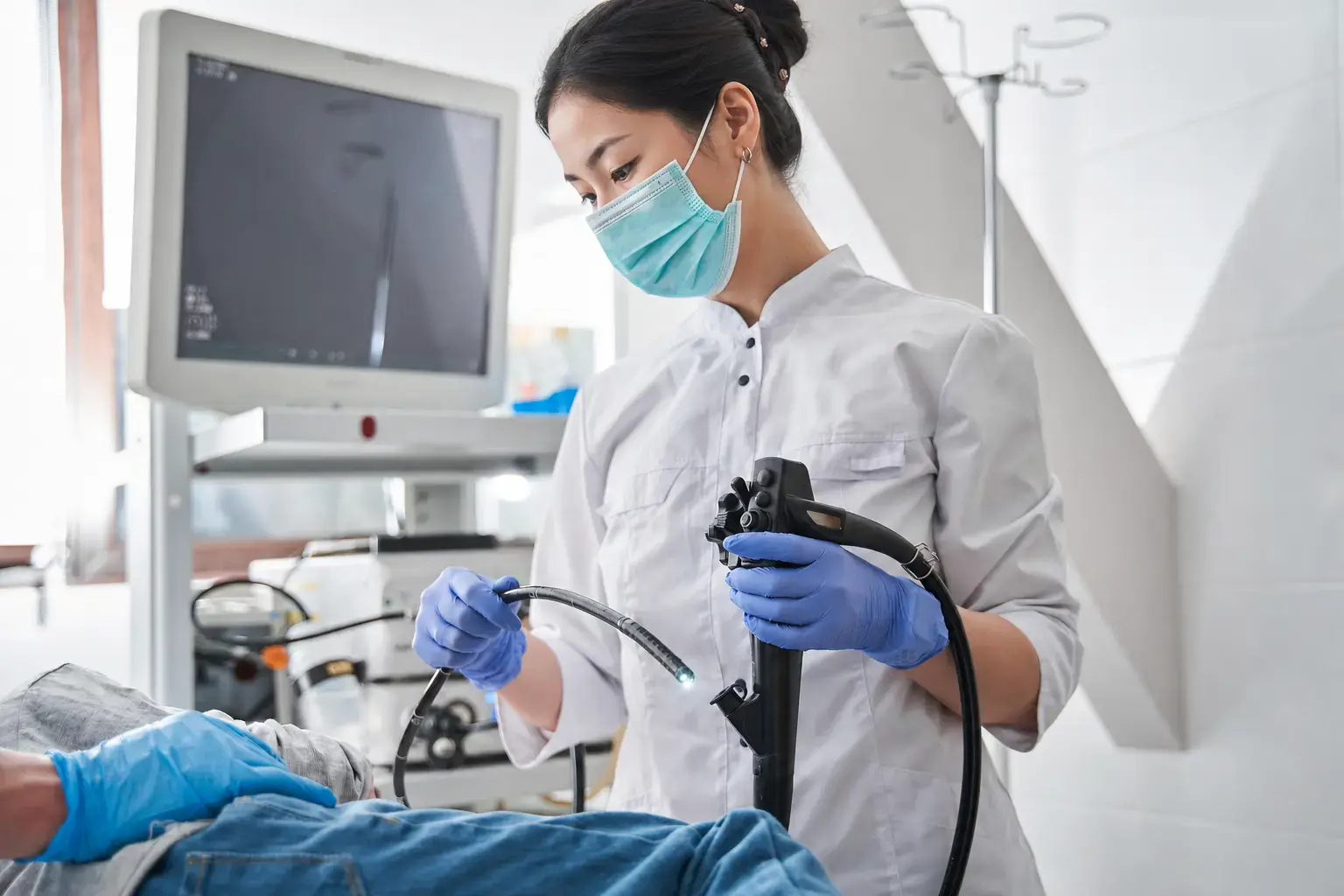A clinician preparing for a painless gastroscopy.