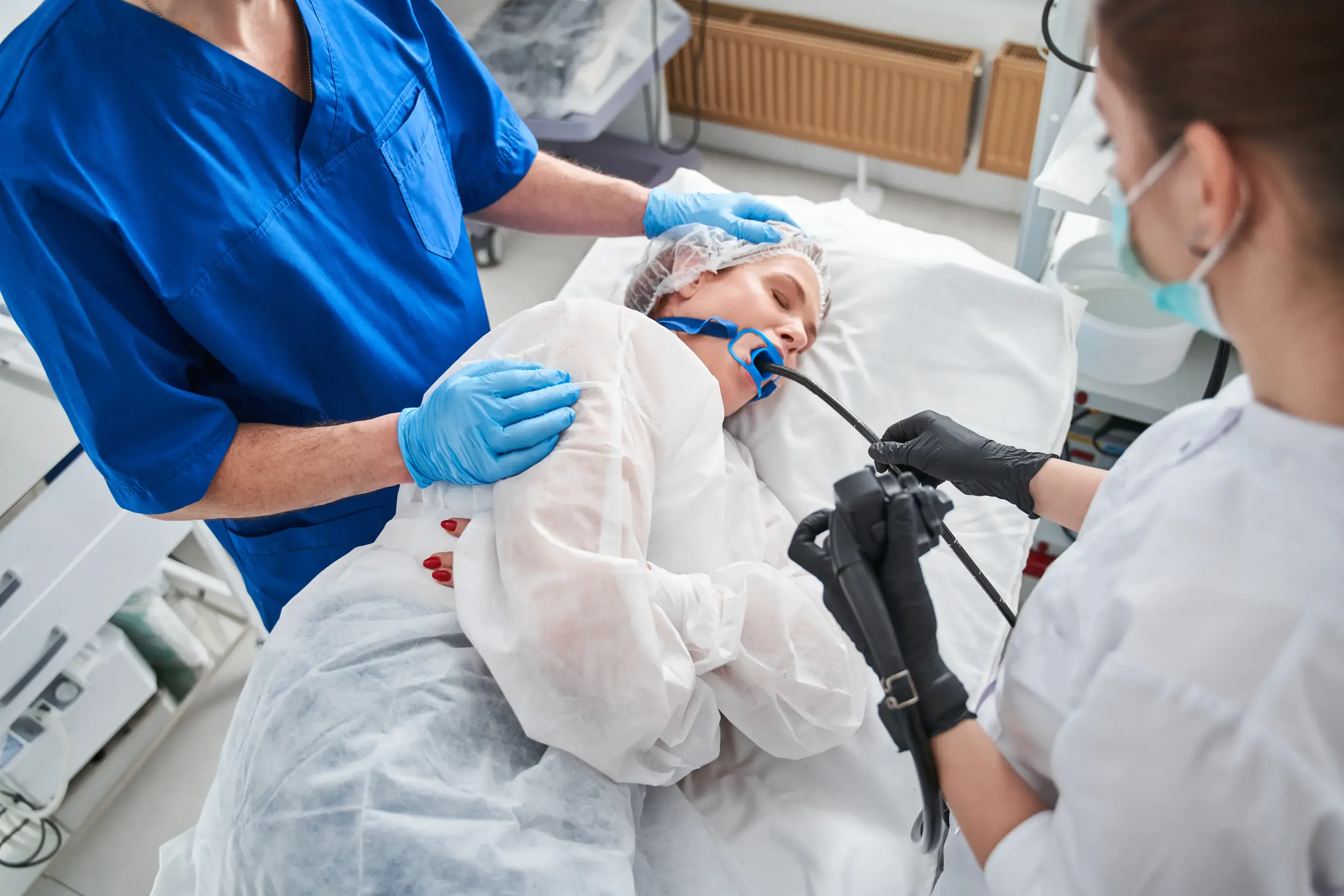 A medical team carrying out a painless gastroscopy.