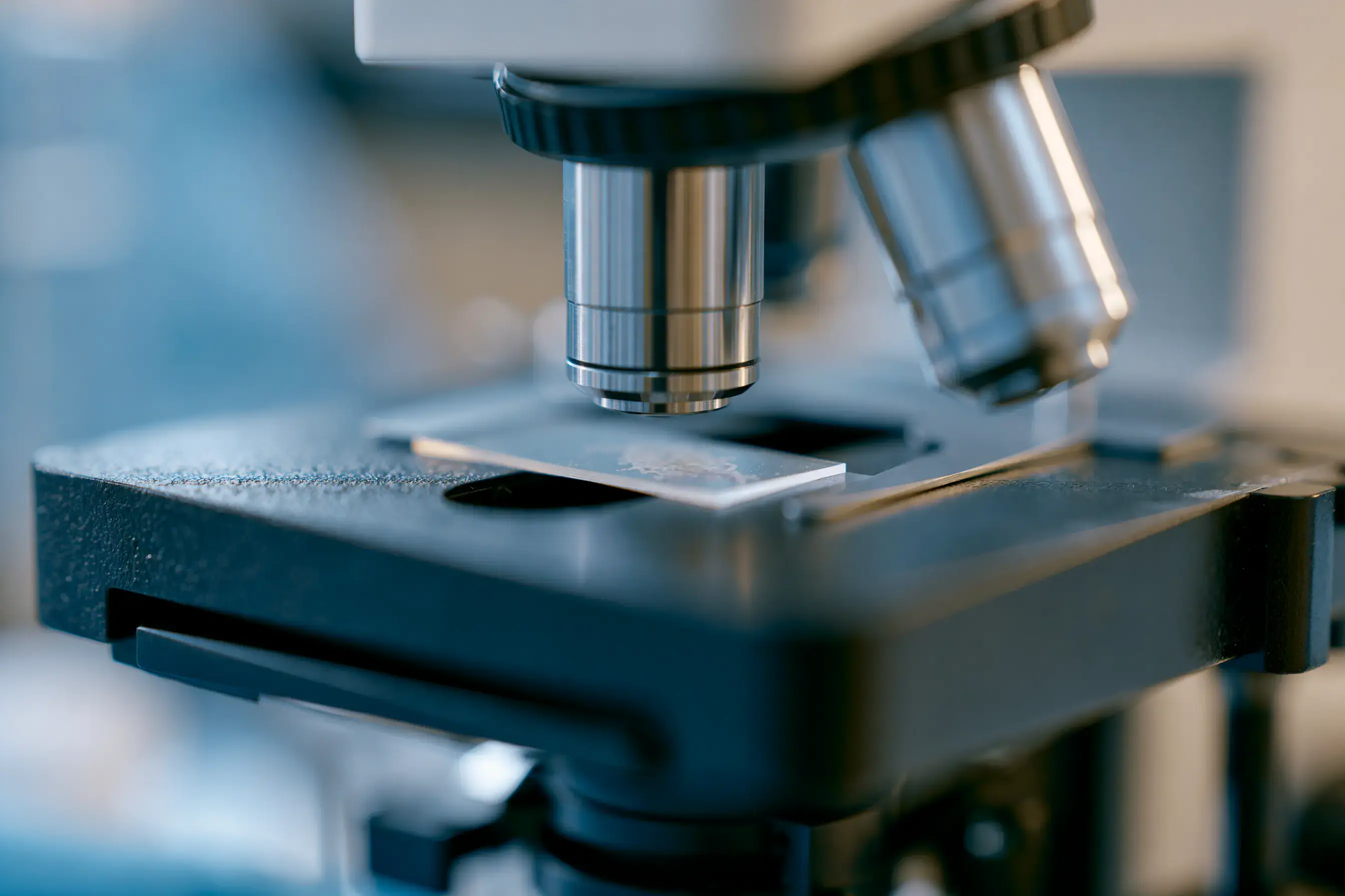 A microscope examining a specimen slide during immune marker analysis.