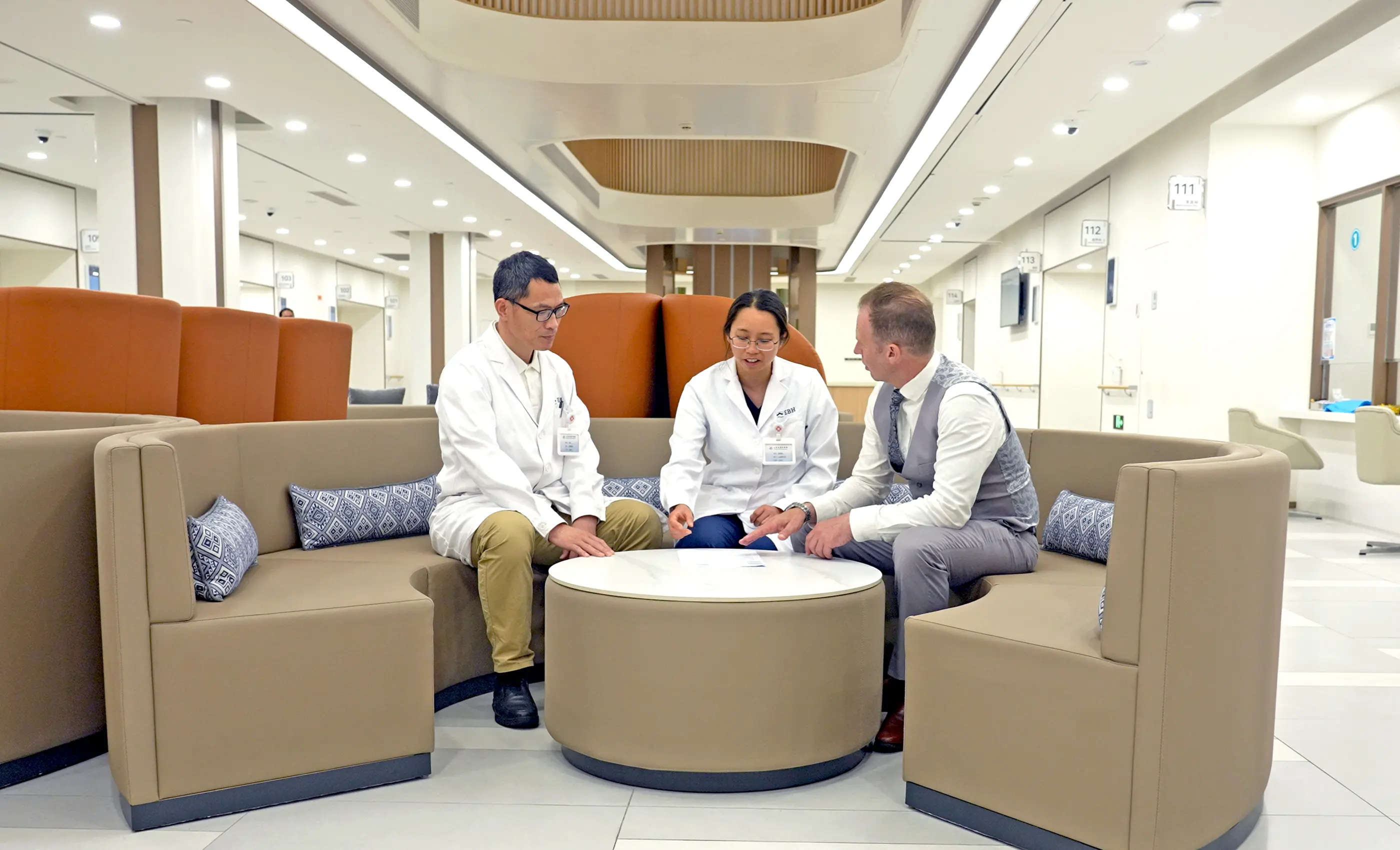 A guest reviewing his results with two physicians at Shanghai International Medical Center.