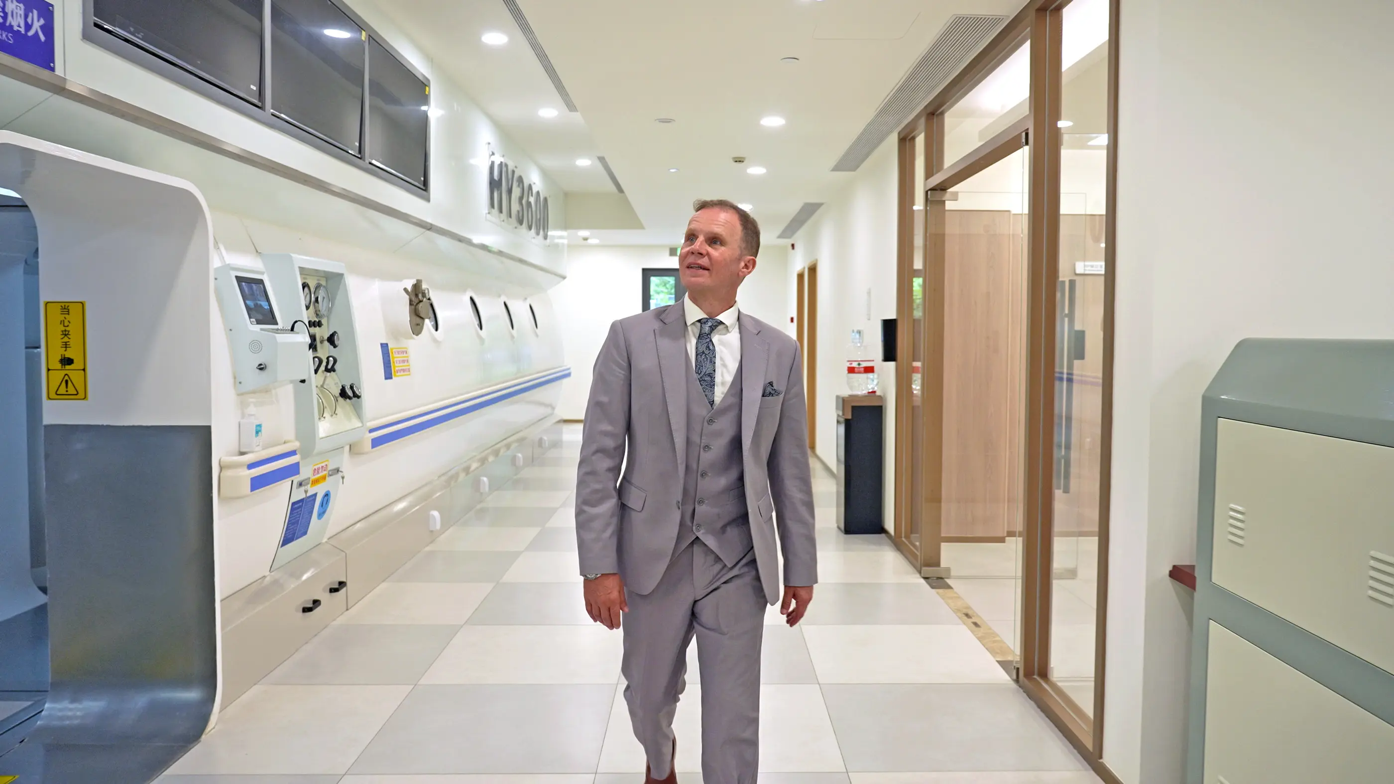 Walking beside the hyperbaric oxygen chamber at Shanghai International Medical Center.