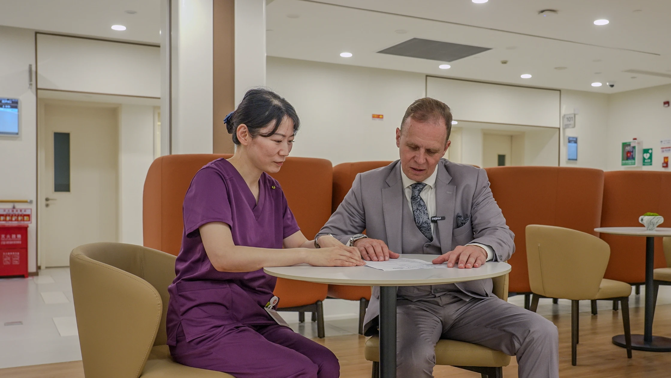 A doctor talking a patient through their results during a consultation.