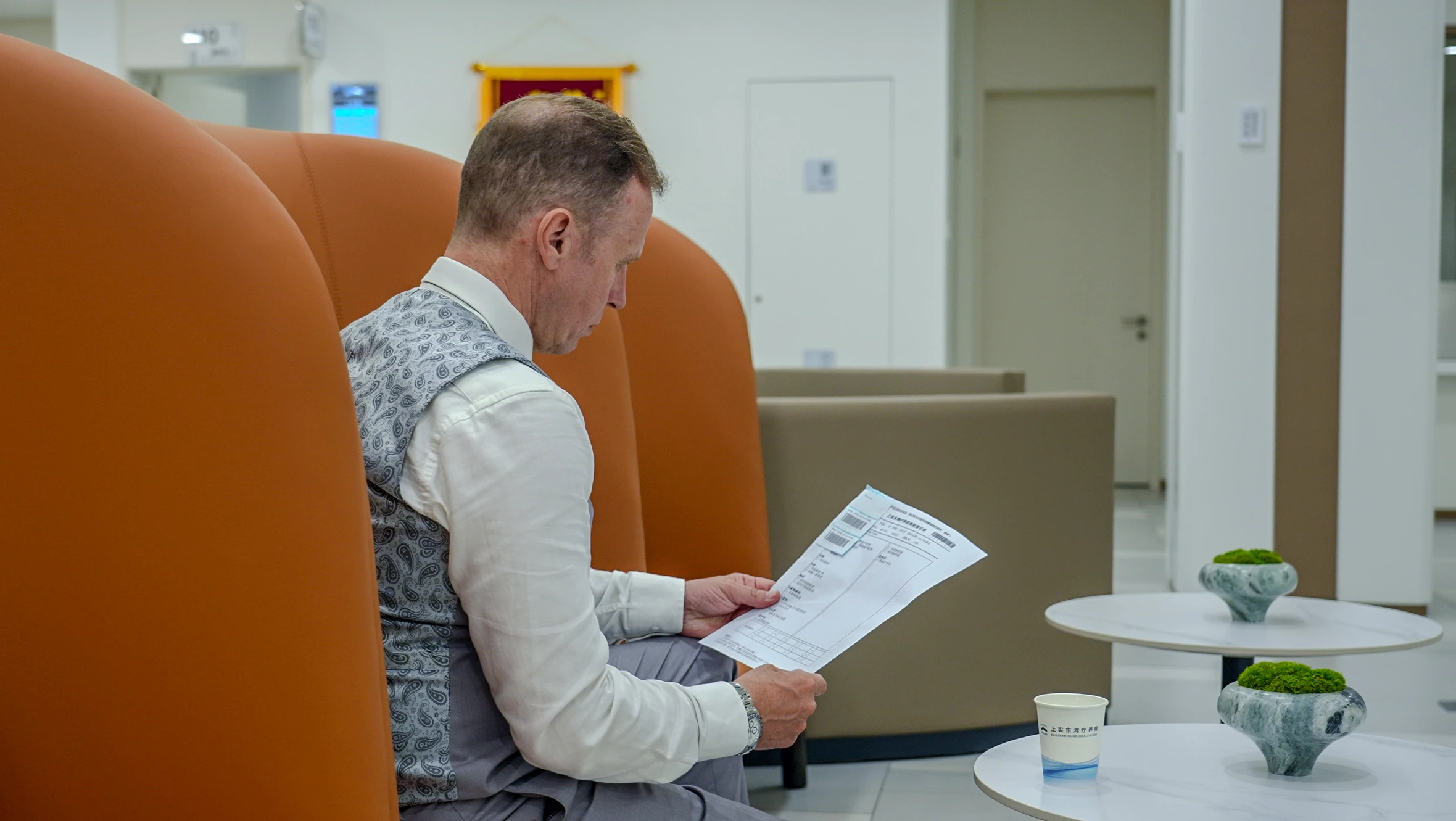 A doctor checking through a patient's results.